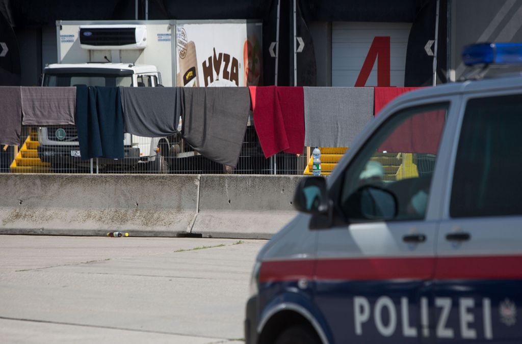 (FILES) This file photo taken on August 28, 2015 shows a refrigerated truck, in which bodies of 71 migrants have been found on the A 4 Austrian highway, parked in a facility which used to be a veterinary station at the border in Nickelsdorf, Austria.  / A