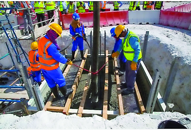 Workers at the construction site of the Al Rayyan Stadium.