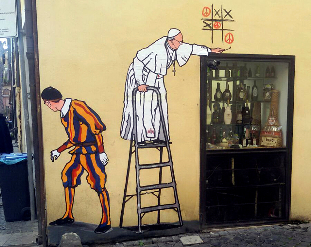 A graffiti depicting Pope Francis and a Swiss guard is seen in Borgo Pio, in Rome, Italy, October 19, 2016. REUTERS/Stringer