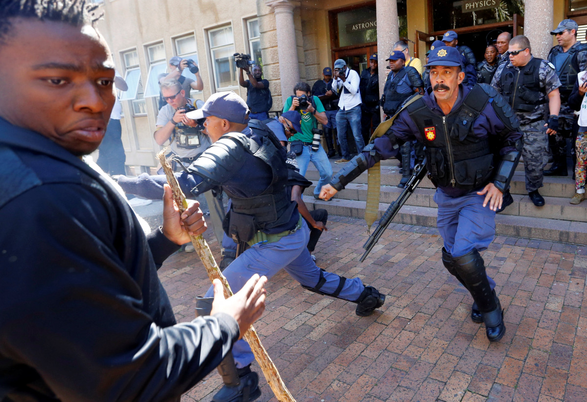 University of Cape Town students clash with police as stun grendes are used during protests demanding free tertiary education in Cape Town, South Africa, October 17, 2016. REUTERS/Mike Hutchings