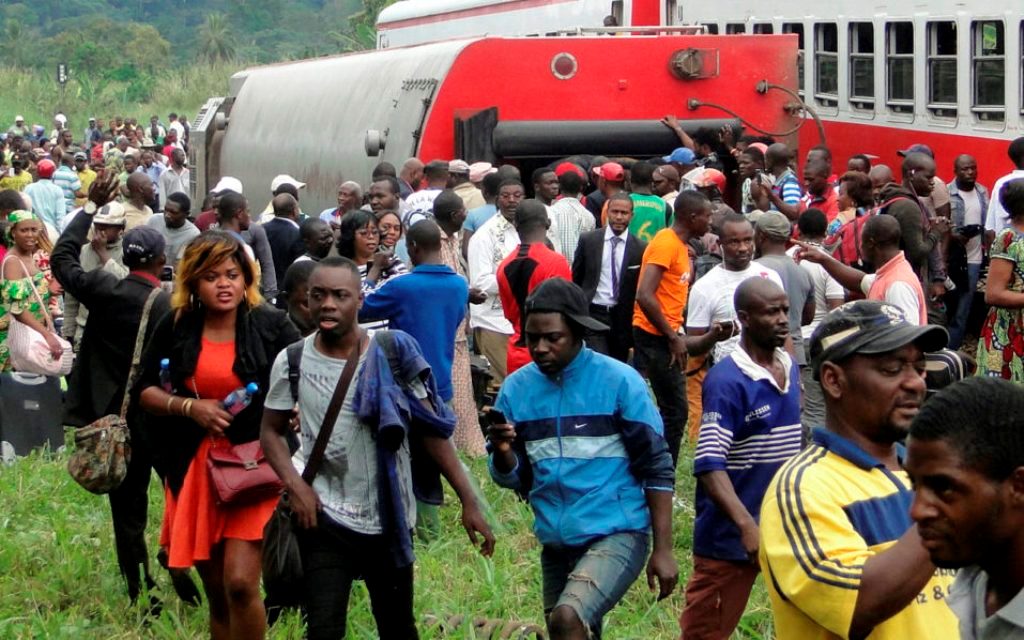 Fifty-three were killed and over 300 injured when a packed Cameroon passenger train derailed on October 21 while travelling between the capital Yaounde and the economic hub Douala, state broadcaster Crtv said. / AFP PHOTO / STRINGER