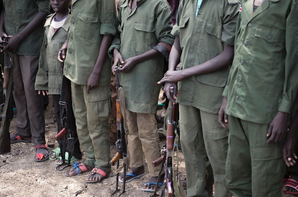 UNICEF estimates that around 16,000 children are currently fighting or working as porters with armed groups in South Sudan, including the national army (AFP Photo/Charles Lomodong)