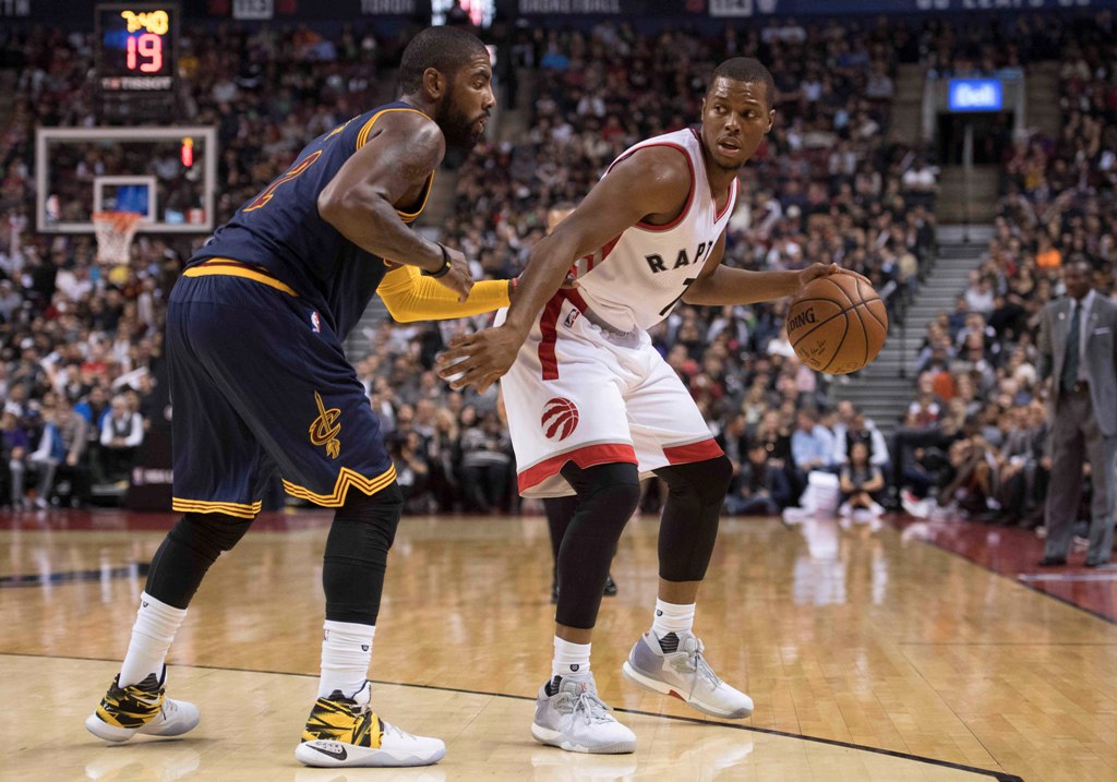 Toronto Raptors guard Kyle Lowry (7) dribbles the ball as Cleveland Cavaliers guard Kyrie Irving (2) defends during the third quarter at Air Canada Centre. The Cavaliers won 94-91.  Credit: Nick Turchiaro