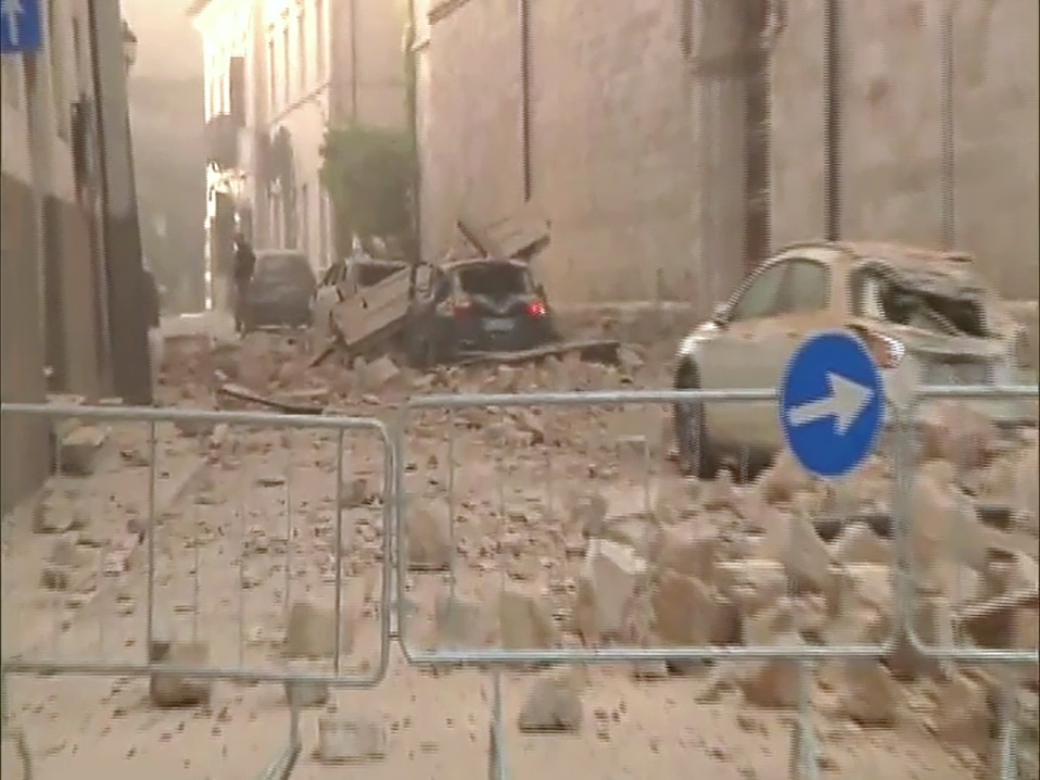 This handout TV grab released by Italian broadcast Sky Tg24 shows destroyed cars under rubbles after an 6.6 magnitude earthquake on October 30, 2016 in Norcia. AFP