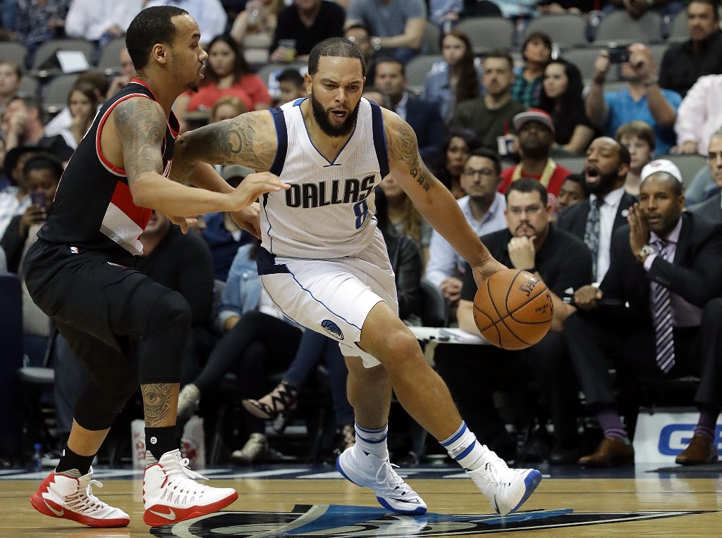 Deron Williams #8 of the Dallas Mavericks dribbles the ball past Shabazz Napier #6 of the Portland Trail Blazers in the second half at American Airlines Center on November 4, 2016 in Dallas, Texas. Ronald Martinez/AFP
