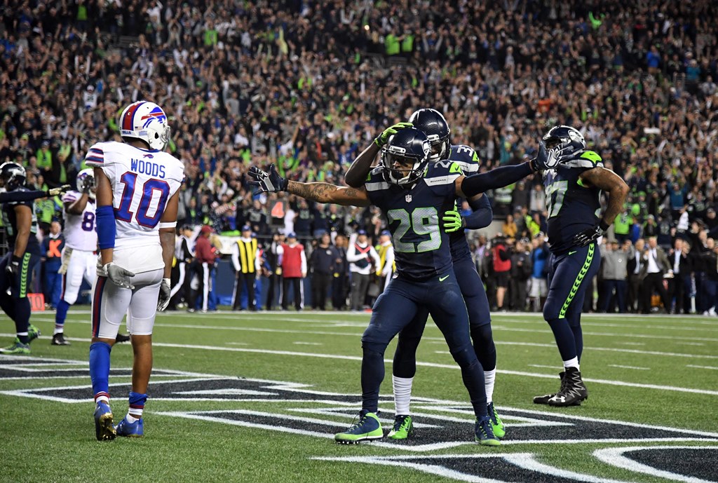 Seattle Seahawks safety Earl Thomas (29) celebrates with safety Kelcie McCray (33) after a Buffalo Bills incomplete pass on fourth down with 13 seconds left as Bills receiver Robert Woods (10) reacts during a NFL football game at CenturyLink Field. Kirby 