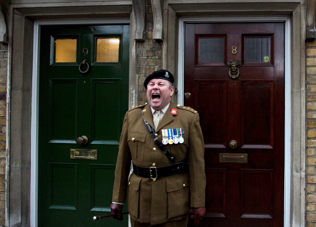 Parade Marshall Captain Gary Tomlin gives a command during a Remembrance Sunday parade through Fulham in West London, Britain November 8, 2009. REUTERS/Kevin Coombs