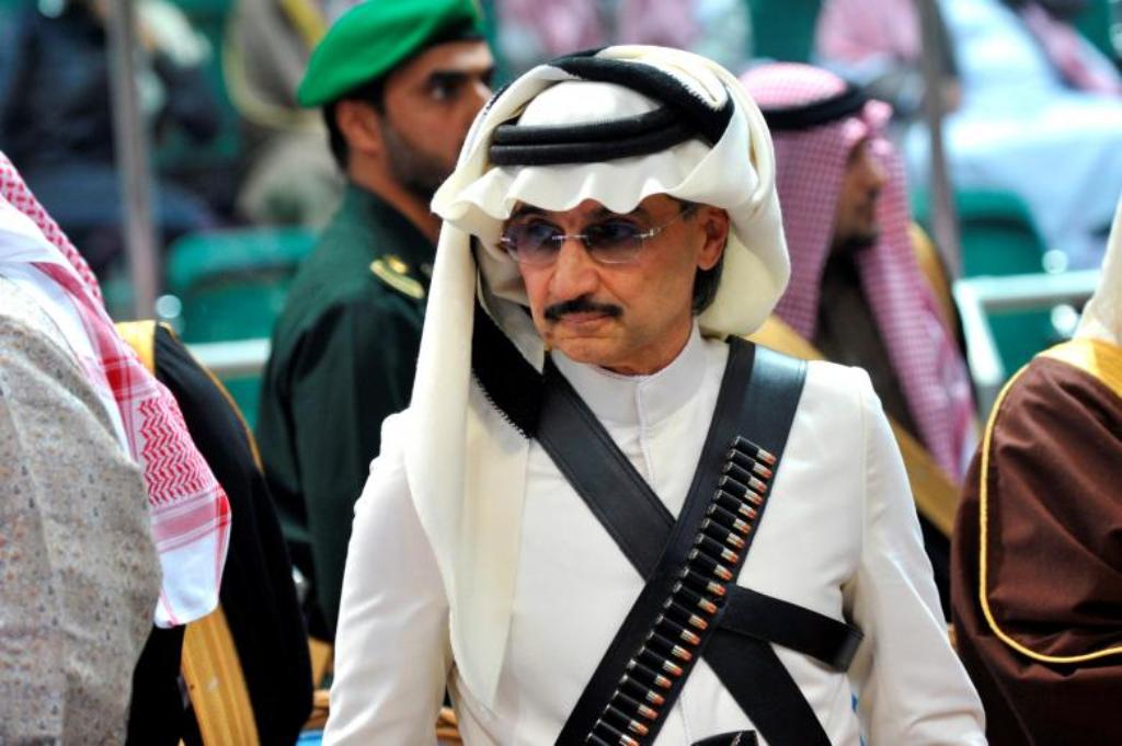 Prince Alwaleed bin Talal attends the traditional Saudi dance known as 'Arda', which was performed during Janadriya culture festival at Der'iya in Riyadh February 18, 2014. REUTERS/Fayez Nureldine/Pool/File Photo