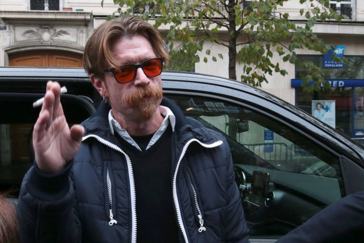 Singers Jesse Hughes of US rock group Eagles of Death Metal arrives near the Bataclan concert hall in Paris on November 13, 2016, for a ceremony to mark the first anniversary of the Paris terror attacks. 130 people were killed on November 13, 2015 by gunm