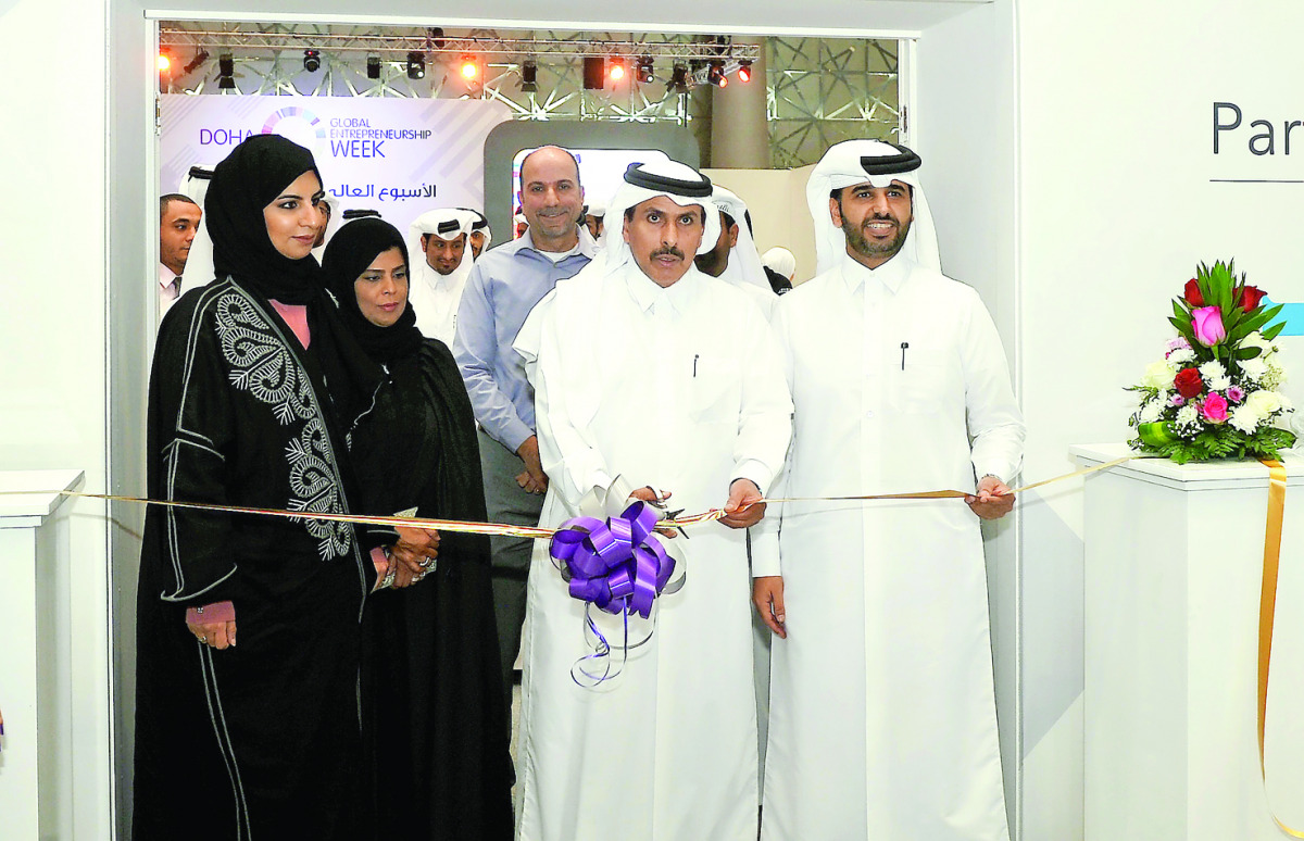 QCB Governor H E Sheikh Abdullah bin Saud Al Thani (second right), and QDB Chief Executive Officer Abdulaziz bin Nasser Al Khalifa (right) cutting ribbon to mark the launch of GEW Qatar. Pic: Kammutty VP / The Peninsula