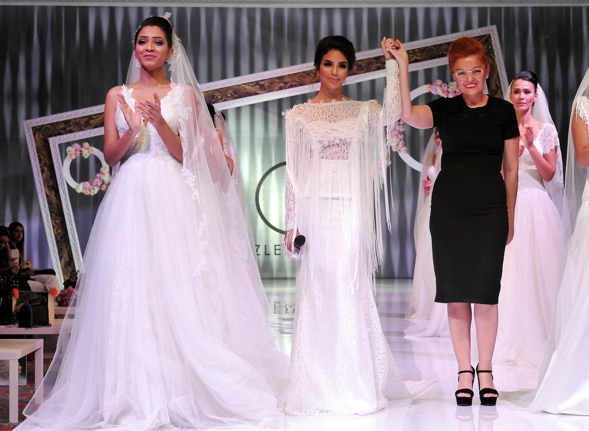 Turkish Designer Ozlem Suer acknowledging the applause of  the  crowd during the Wedding by Shangri-La Exclusive Fashion Show at Shangri-La Hotel Doha recently. (Kammutty VP / The Peninsula)