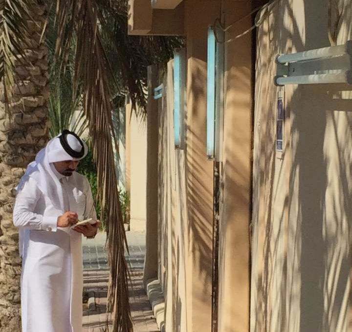 A Kahramaa official fining a residential property for keeping the lights on in the morning. (Photo: Kahramaa)