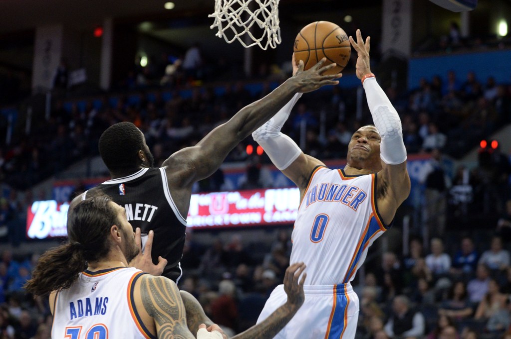 Oklahoma City Thunder guard Russell Westbrook (0) shoots the ball over Brooklyn Nets forward Anthony Bennett (13) during the fourth quarter at Chesapeake Energy Arena. / Mark D. Smith