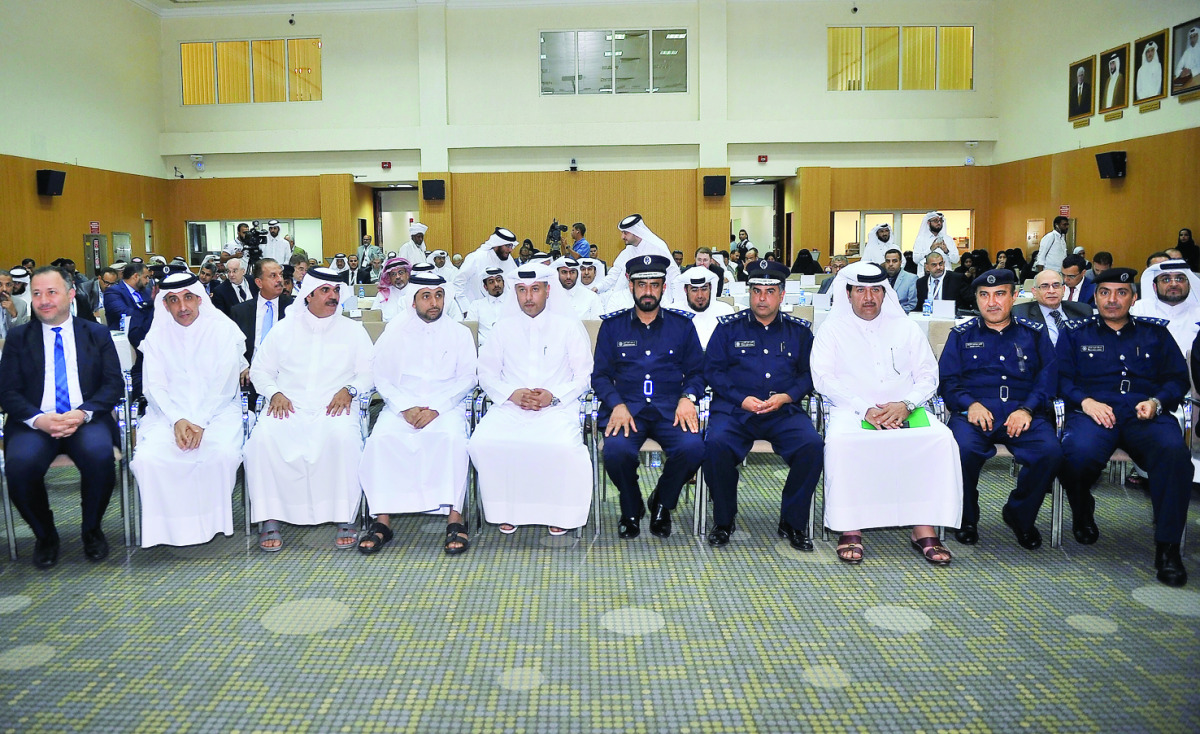 H E Issa Saad Al Juffali Al Nuaimi, Minister for Administrative Development and Labour and Social Affairs, Dr Yousef Mahmoud Al Siddiqi, Dean of Shariah and Islamic Studies at Qatar University, with other officials during the 'International Conference on 