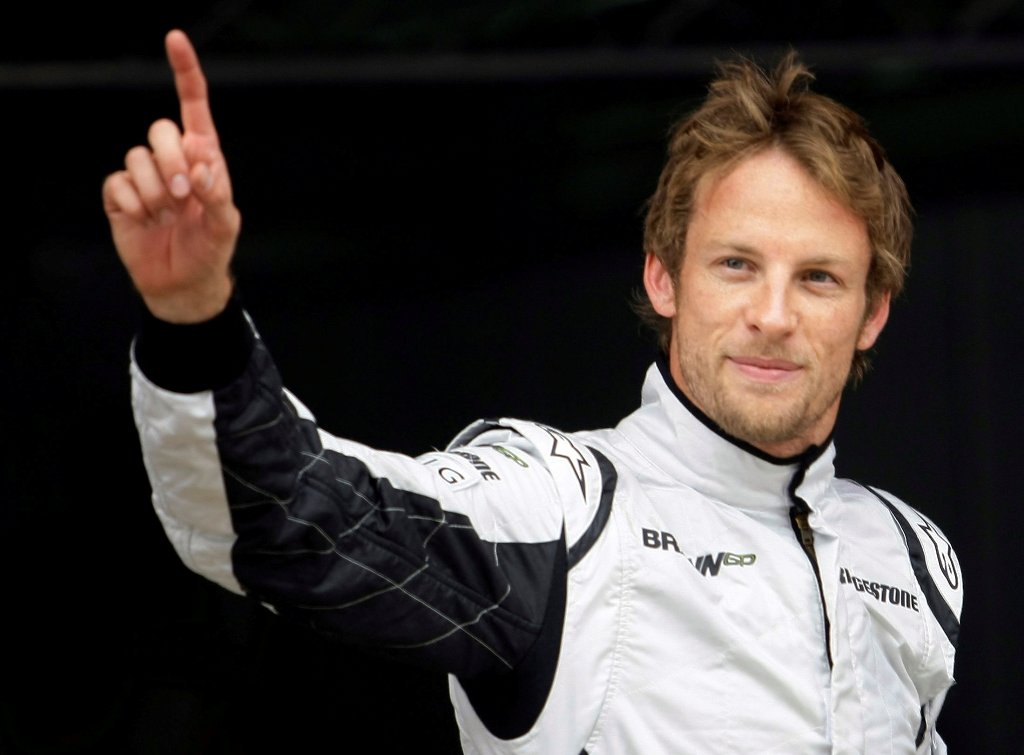 FILE PHOTO - Brawn GP Formula One driver Jenson Button of Britain waves after qualifying in pole position for the Spanish F1 Grand Prix at the Catalunya racetrack in Montmelo, near Barcelona, May 9, 2009. REUTERS/Dani Cardona/File Photo
