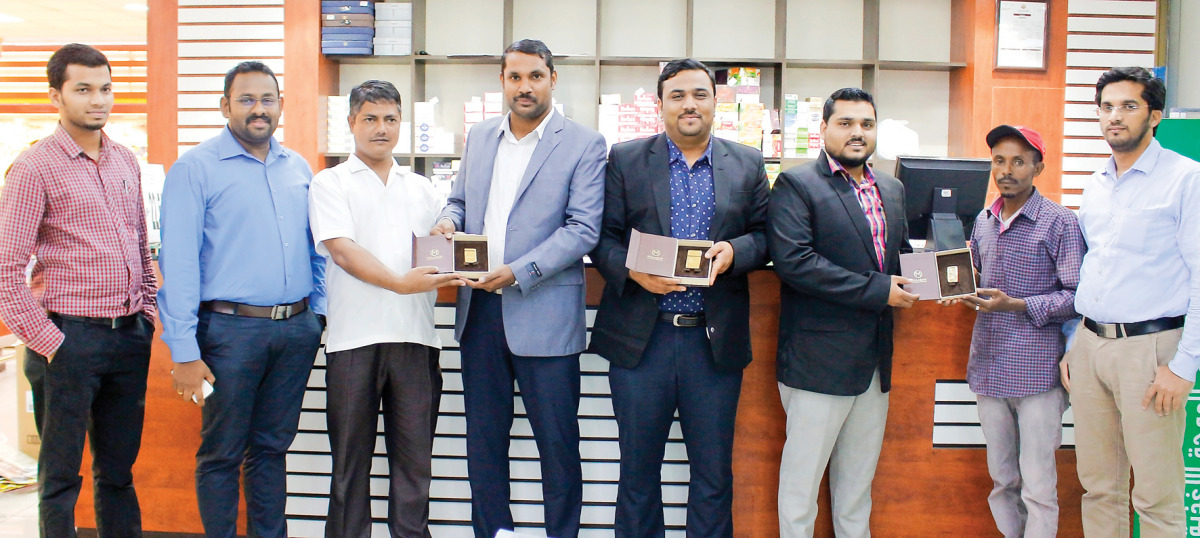 Management officials with winners of Mega Gold Promotion 2016.
