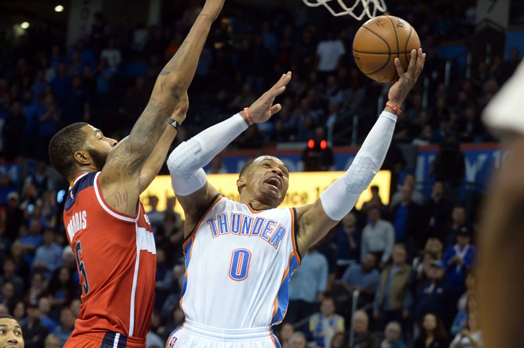 Oklahoma City Thunder guard Russell Westbrook (0) shoots the ball in front of Washington Wizards forward Markieff Morris (5) during the fourth quarter at Chesapeake Energy Arena. Mandatory Credit: Mark D. Smith-USA TODAY Sports