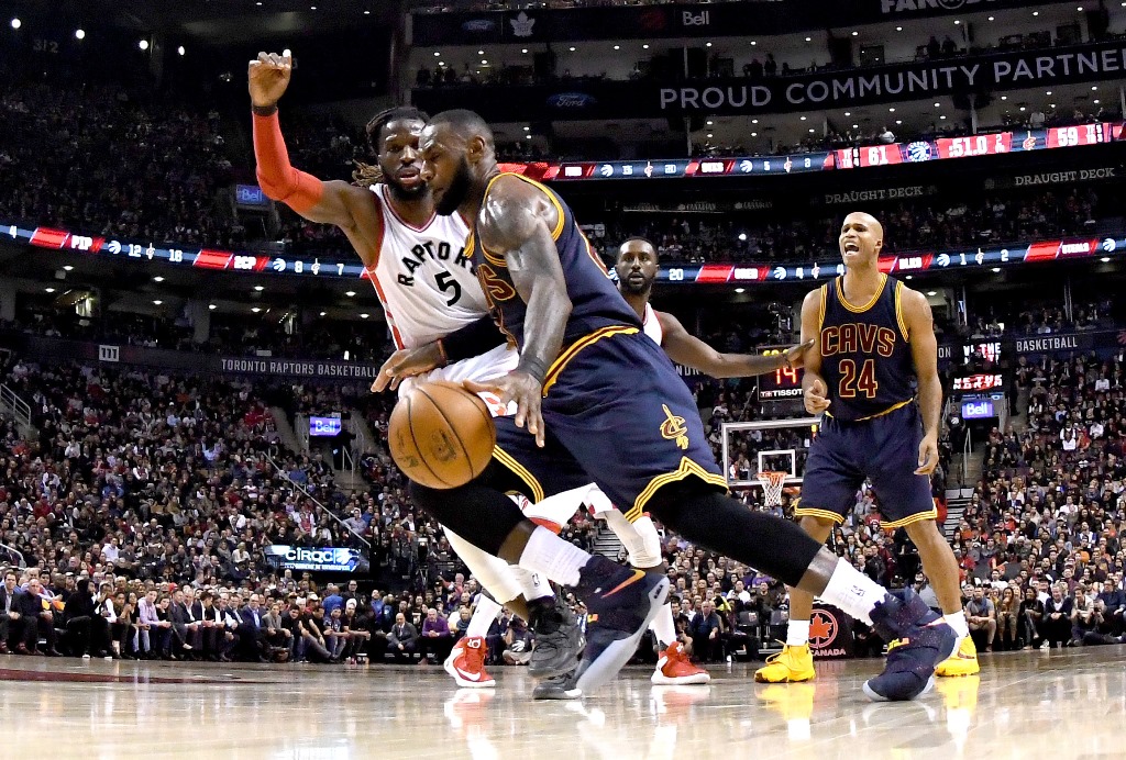 Cleveland Cavaliers forward LeBron James (23) drives to the basket past Toronto Raptors forward DeMarre Carroll (5) in the first half at Air Canada Centre. Dan Hamilton-USA TODAY Sports