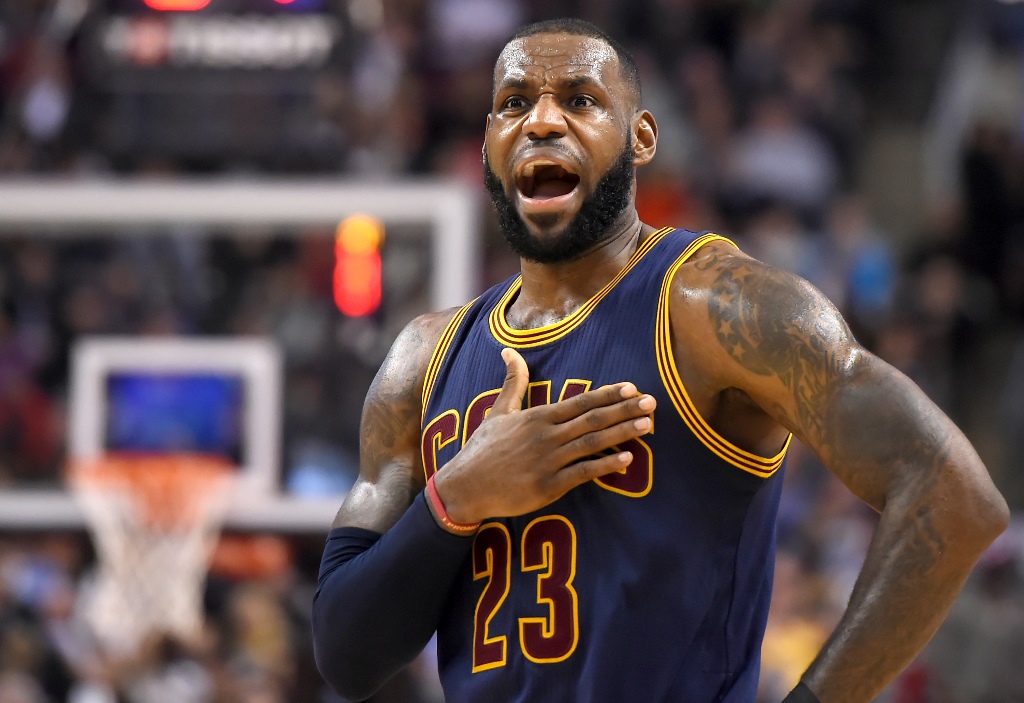 Cleveland Cavaliers forward LeBron James (23) reacts to a foul call during the second half of a 116-112 win over Toronto Raptors at Air Canada Centre. Mandatory Credit: Dan Hamilton-USA TODAY Sports