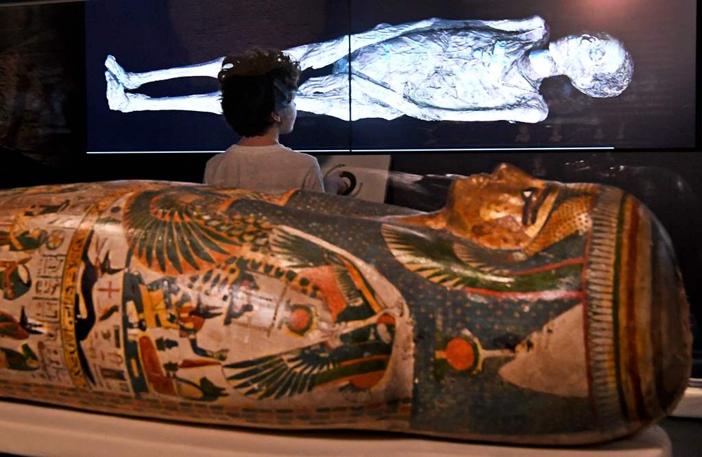 A young boy looks at a three-dimensional image of a CT scan of an Egyptian mummy as the the hidden secrets of Egyptian mummies up to 3,000 years old have been virtually unwrapped and reconstructed for the first time using cutting-edge scanning technology 