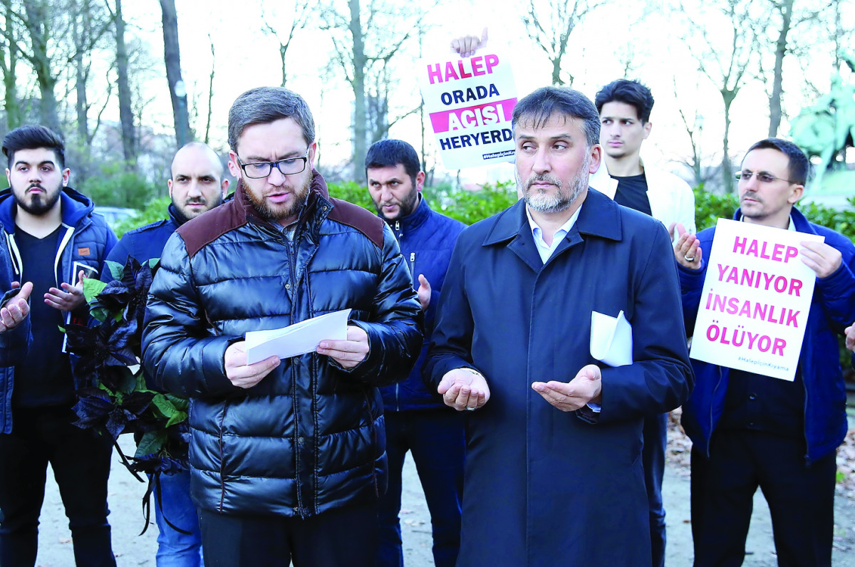 People gather outside Syrian Embassy in Brussels yesterday to protest against Assad regime forces’ and its supporters’ attacks on civilians and the humanitarian plight in Aleppo. 