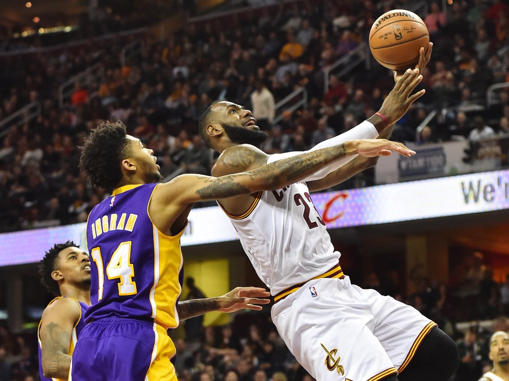 Cleveland Cavaliers forward LeBron James (23) drives to the basket against Los Angeles Lakers forward Brandon Ingram (14) during the second half at Quicken Loans Arena. Ken Blaze/USA TODAY Sports