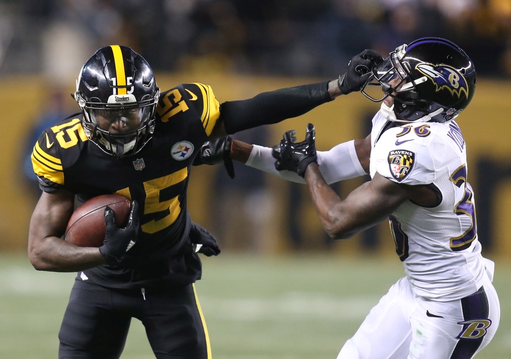 Pittsburgh Steelers wide receiver Demarcus Ayers (15) stiff arms Baltimore Ravens cornerback Tavon Young (36) during the fourth quarter at Heinz Field. The Steelers won 31-27. Charles LeClaire