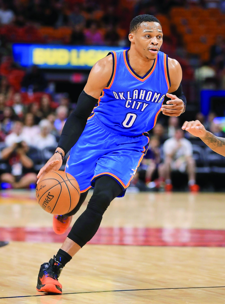 Russell Westbrook  of the Oklahoma City Thunder dribbles the ball during their NBA  game against the Miami Heat at American Airlines Arena in Miami, Florida, USA on Tuesday. 