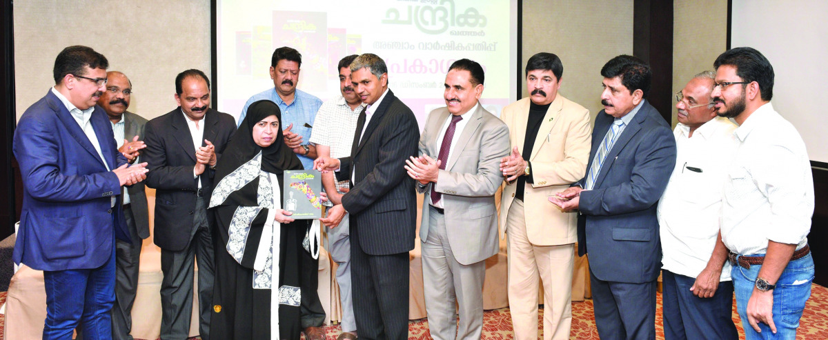 Indian Ambassador P Kumaran hands the first copy of the Chandrika Annual magazine, an Indian publication, to Qatari poet Dr Zakia Ali Malallah. Also seen are Parakkal Abdulla, a member of Kerala's Legislative Assembly, P N Baburajan, K K Usman, C N Unnikr