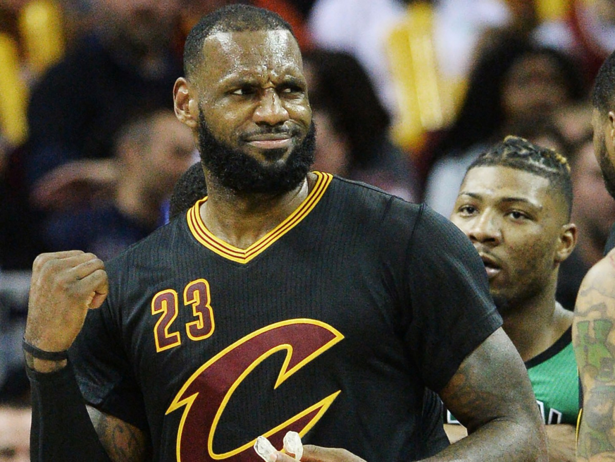 Cleveland Cavaliers forward LeBron James (23) reacts after a confrontation with Boston Celtics guard Marcus Smart (36) during the second half at Quicken Loans Arena. The Cavs won 124-118. Mandatory Credit: Ken Blaze-USA TODAY Sports