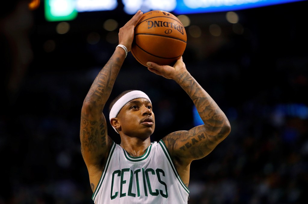 Boston Celtics guard Isaiah Thomas (4) shoots against the Miami Heat during the second half at TD Garden. Mandatory Credit: Winslow Townson
