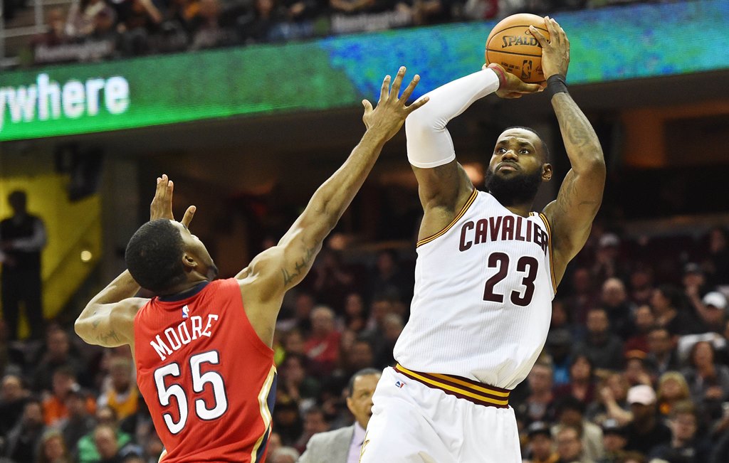 Cleveland Cavaliers forward LeBron James (23) shoots over the defense of New Orleans Pelicans guard E'Twaun Moore (55) during the second half at Quicken Loans Arena. Ken Blaze-USA TODAY Sports