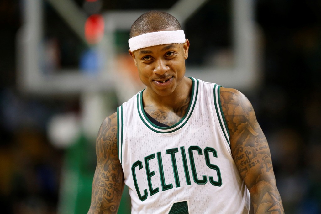 Boston Celtics point guard Isaiah Thomas (4) smiles after a basket during the fourth quarter against the Utah Jazz at TD Garden. The Boston Celtics won 115-104. Greg M. Cooper