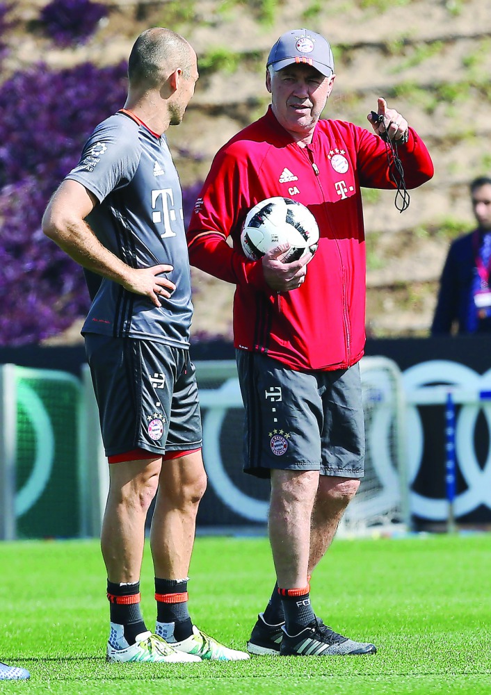 Bayern Munich's Italian coach Carlo Ancelotti (right) attends a training session at the Aspire Academy in Doha yesterday.