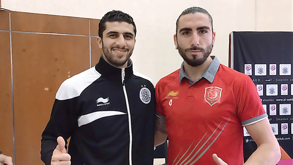 Al Sadd defender Ibrahim Majid and Lekhwiya defender Chico Flores pose for a photograph during a press conference ahead of their Qatar Stars League game which will be played at Al Sadd Stadium tomorrow.