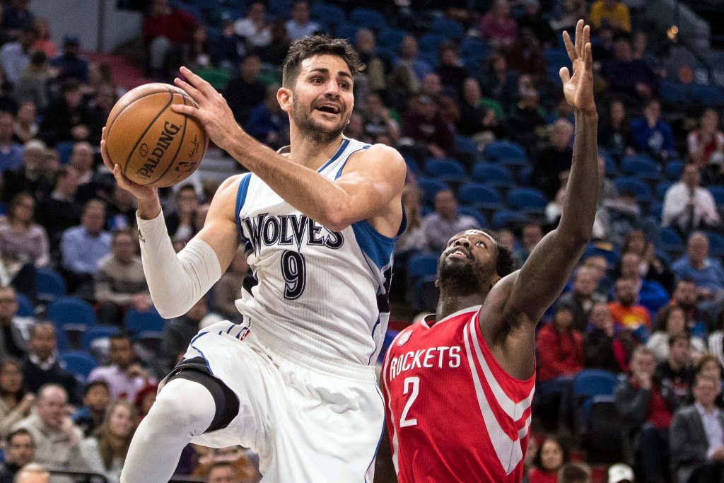 Minnesota Timberwolves guard Ricky Rubio (9) passes around Houston Rockets guard Patrick Beverley (2) during the third quarter at Target Center. The Timberwolves defeated the Rockets 119-105. Mandatory Credit: Brace Hemmelgarn-USA TODAY Sports