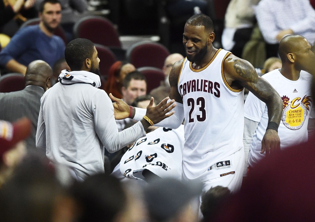 Cleveland, OH, USA; Cleveland Cavaliers forward LeBron James (23) celebrates with guard Kyrie Irving (2) after leaving the game during the second half against the Brooklyn Nets at Quicken Loans Arena. The Cavs won 124-116. Ken Blaze
