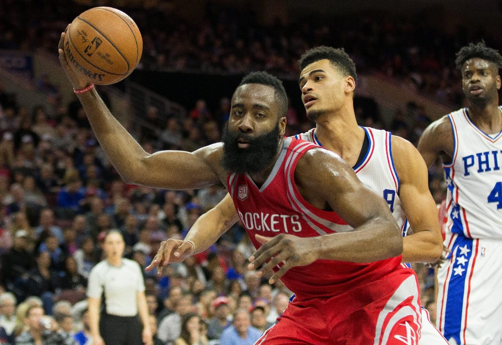 Houston Rockets guard James Harden (13) controls a rebound past Philadelphia 76ers guard Timothe Luwawu-Cabarrot (20) during the third quarter at Wells Fargo Center. The Houston Rockets won123-118. Mandatory Credit: Bill Streicher-USA TODAY Sports
