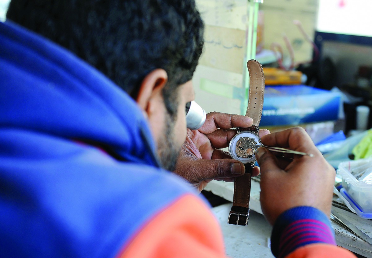 A vendor repairing a watch at his shop. Pic: Salim Matramkot / The Peninsula