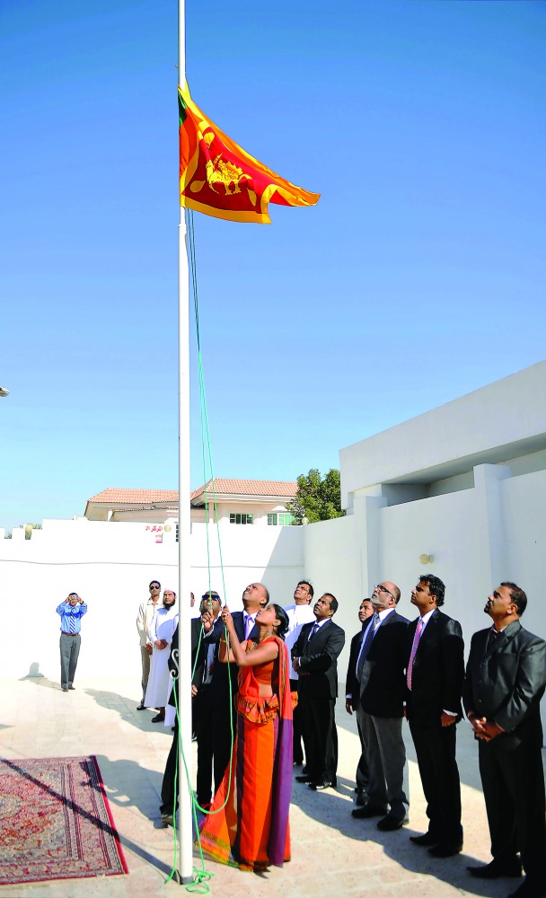 K H C Sankapali, chargé d'affaires at the embassy, hoisting the Sri Lankan national flag at the embassy premises yesterday. Pic: Abdul Basit / The Peninsula