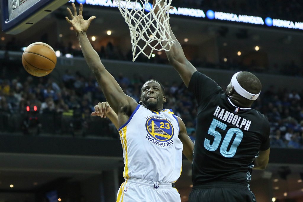 Golden State Warriors forward Draymond Green (23) loses control of the ball as Memphis Grizzlies forward Zach Randolph (50) defends in the second half at FedExForum. Golden State defeated Memphis 122-107.  Credit: Nelson Chenault
