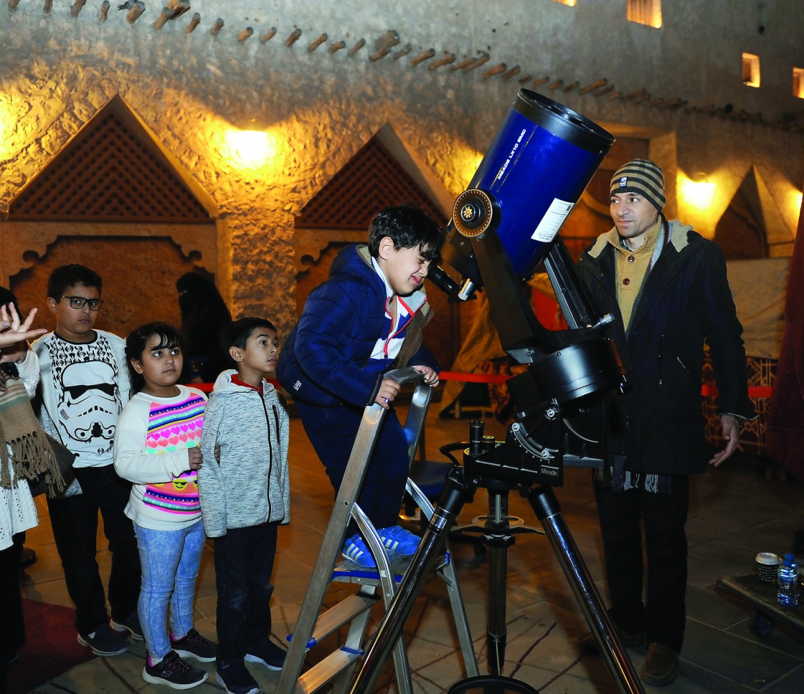 Children at the Souq Waqif seeing the planets through a telescope. Pic: Salim Matramkot / The Peninsula