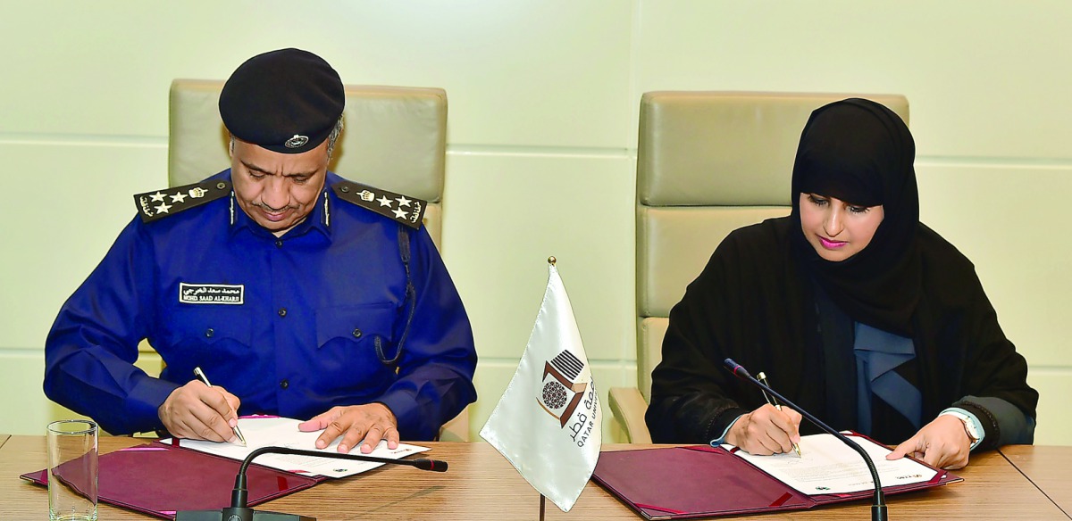 QU's Vice-President for Research and Graduate Studies Prof Mariam Al-Maadeed and General Directorate of Traffic Director Brigadier Mohammed Saad Al-Kharji signing the agreement.