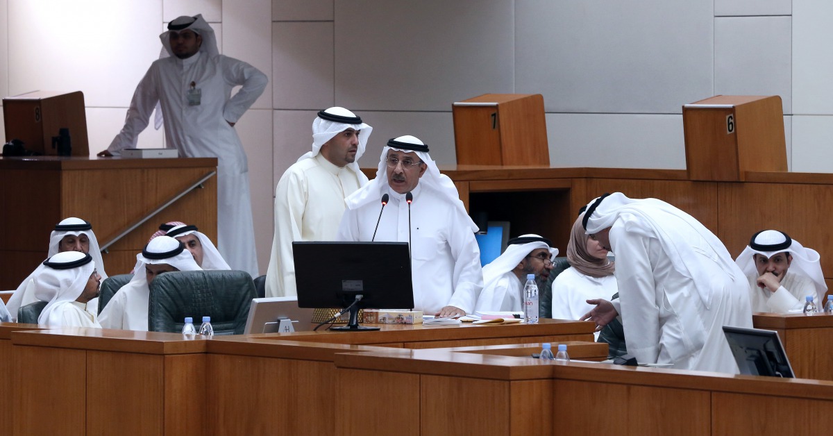 FILE PHOTO: Kuwaiti Electricity Water Minister Ahmad al-Jassar speaks as Oil Finance Minister Anas al-Saleh looks on during a session at the national assembly in Kuwait City on April 13, 2016 (AFP / YASSER AL-ZAYYAT) 