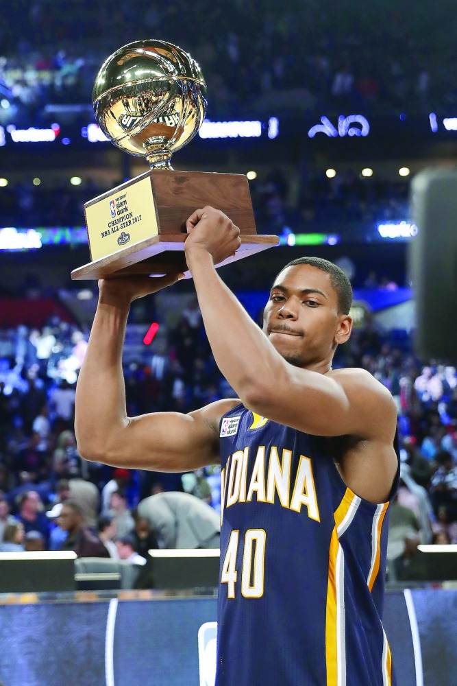 Glenn Robinson of the Indiana Pacers poses with the trophy after winning the 2017 Verizon Slam Dunk Contest in New Orleans, Louisiana on Saturday.