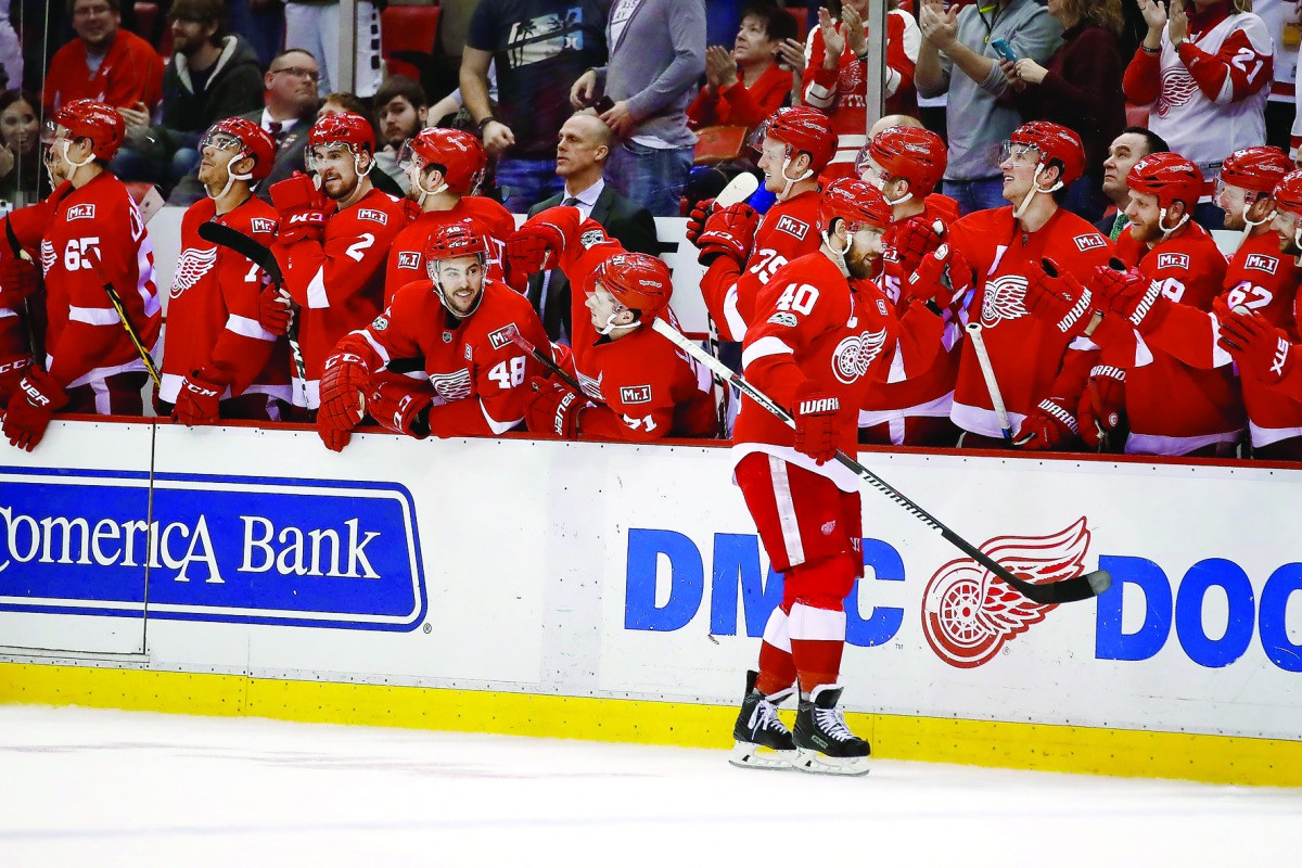 Henrik Zetterberg (40) of the Detroit Red Wings celebrates his shootout goal with team-mates while playing against the Washington Capitals at Joe Louis Arena in Detroit on Saturday. 