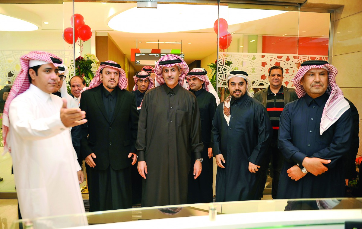 Sheikh Dr Khalid bin Thani bin Abdullah Al Thani, (centre) Chairman and Managing Director of QIIB, touring the new branch at Mall of Qatar with other senior officials and guests yesterday. Pic: Abdul Basit /The Peninsula