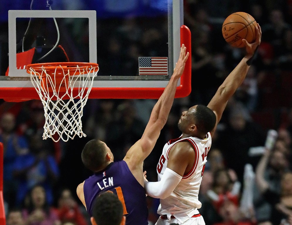 Dwyane Wade #3 of the Chicago Bulls goes up for a dunk over Alex Len #21 of the Phoenix Suns at the United Center on February 24, 2017 in Chicago, Illinois. Jonathan Daniel/AFP
