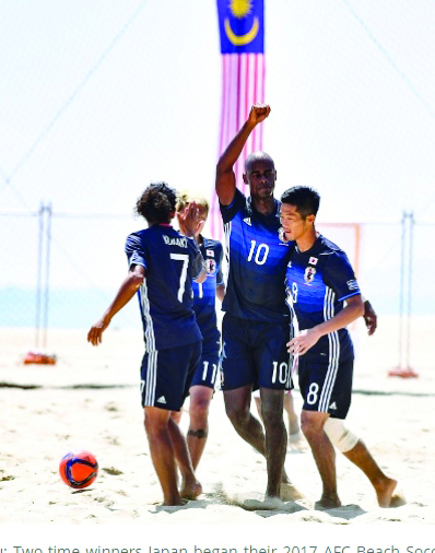 Japan players celebrate after scoring against Qatar in the AFC Beach Soccer Championship in Malaysia yesterday.