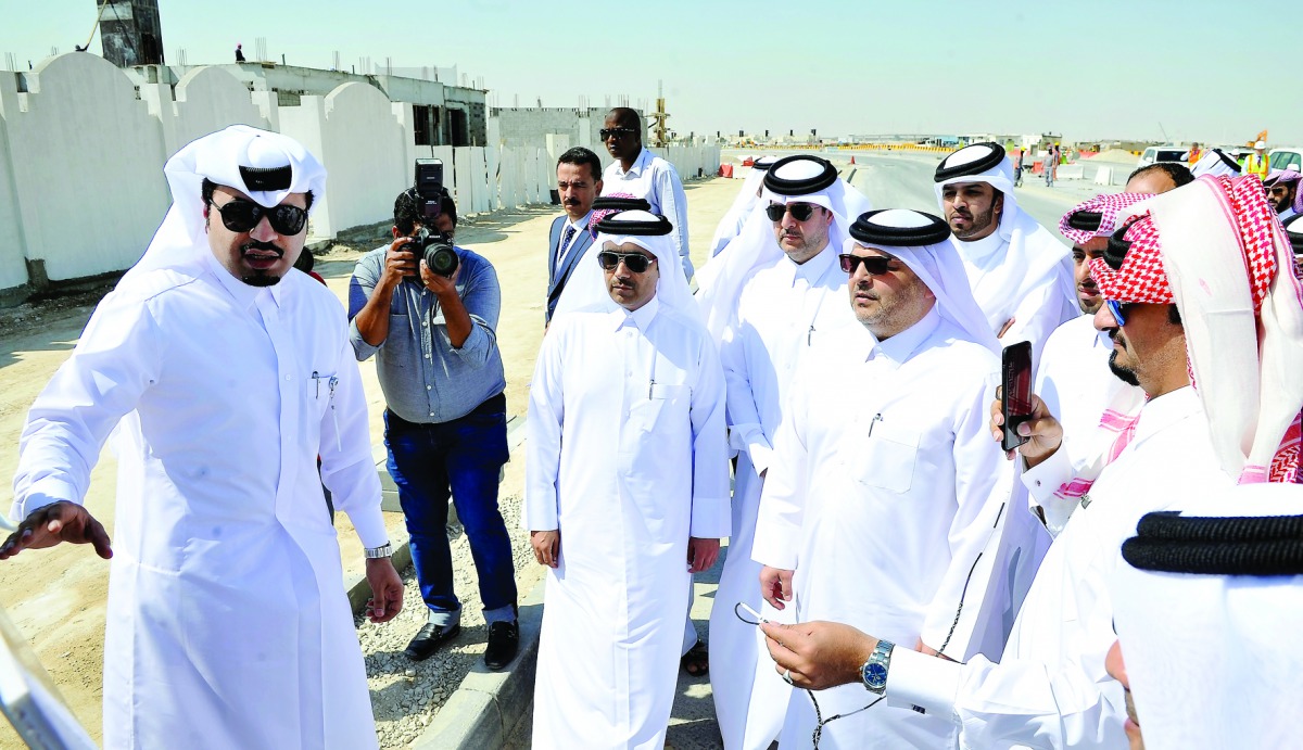 Essa Bin Hilal Al Kuwari (third left), President of Qatar General Electricity and Water Corporation; Dr Saad bin Ahmed Al Mohannadi (centre), President of Public Works Authority (Ashghal); and other officials at the construction site tour at the location 